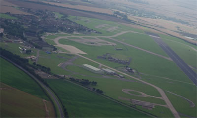 An aerial view of the operational readiness platform (ORP) at RAF Scampton where the Vulcans on QRA duty would sit awaiting a scramble. The Supplementary Storage Area where nuclear weapons were stored is visible at upper right in the shot. An aerial view of the operational readiness platform (ORP) at RAF Scampton where the Vulcans on QRA duty would sit awaiting a scramble. The Supplementary Storage Area where nuclear weapons were stored is visible at upper right in the shot.
