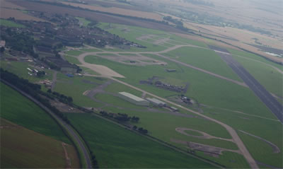 An aerial view of the operational readiness platform (ORP) at RAF Scampton where the Vulcans on QRA duty would sit awaiting a scramble. The Supplementary Storage Area where nuclear weapons were stored is visible at upper right in the shot.